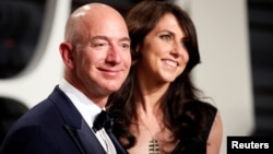 FILE - Amazon's Jeff Bezos and MacKenzie Bezos are seen before their recent divorce at the 89th Academy Awards Oscars Vanity Fair Party, Beverly Hills, California, U.S., Feb 2, 2017.