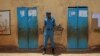 A member of the Sudanese security forces stands guard outside a polling station, on the second day of Sudan's presidential and legislative elections, in Izba, an impoverished neighborhood on the outskirts of Khartoum, Sudan, April 14, 2015.