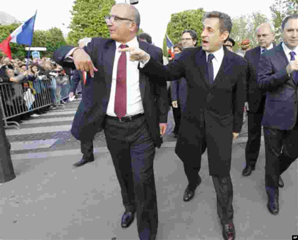 French President and candidate for the French presidential election Nicolas Sarkozy arrives at their ceremony marking the 97th anniversary of the Armenian genocide, Tuesday, April, 24, 2012. (AP Photo/Jacques Brinon Pool)