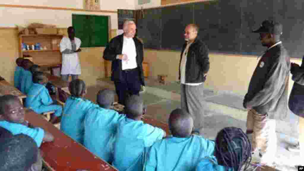 Vicenza Bishop Beniamino Pizziol, second from left, flanked by father Gianantonio Alllegri, second from right, during a visit in the Catholic primary school of Tchere, Cameroon.