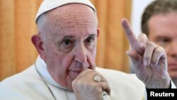 Pope Francis speaks to journalists on his flight back to Rome, Nov. 1, 2016. 