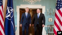 Secretary of State Mike Pompeo, right, meets with NATO Secretary General Jens Stoltenberg at the State Department in Washington, Sept. 13, 2018.