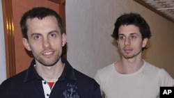 In this May 21, 2010 file photo, American hikers Shane Bauer, left, and Josh Fattal are shown in Tehran, Iran. The lawyer for two Americans jailed as spies in Iran says a $1 million bail-for-freedom deal has been approved by the courts, clearing the way f