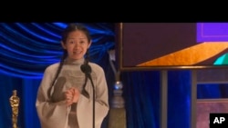 In this video image provided by ABC, Chloe Zhao accepts the award for best director for "Nomadland" at the Oscars on Sunday, April 25, 2021. (ABC via AP)