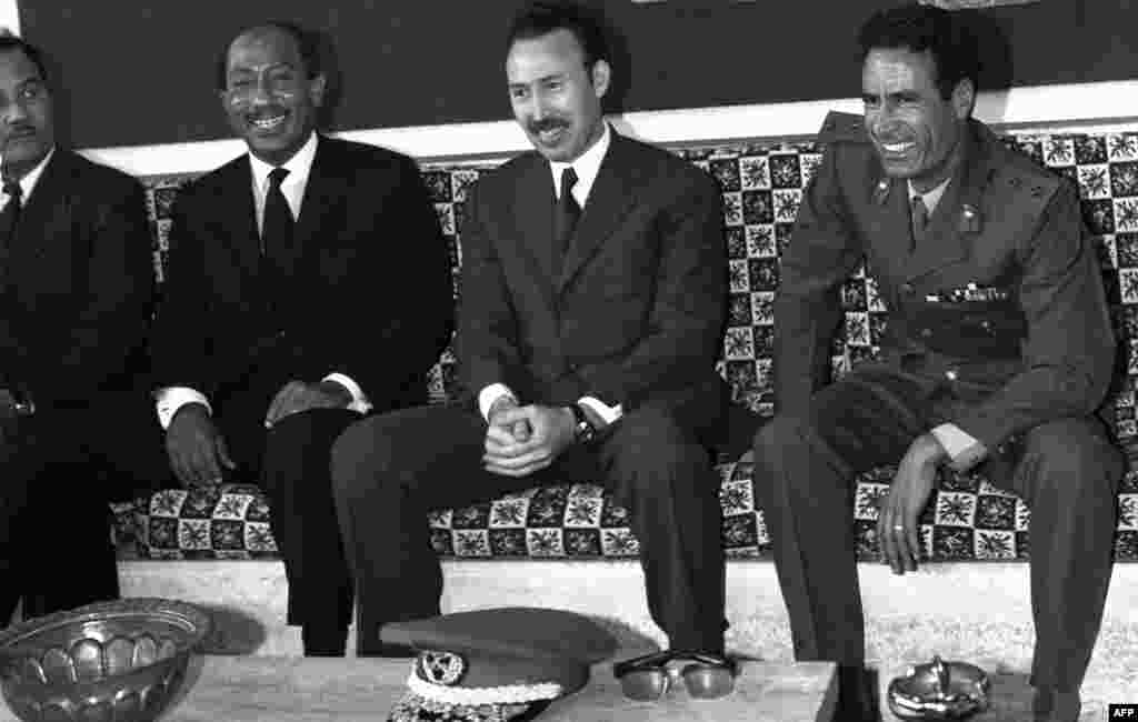 File picture (1972) of Libyan leader Col. Moammar Gadhafi (R) with Egyptian President Anouar al-Sadate (L) and Algerian President Houari Boumediene (C) at the airport while they arrived, (AFP)