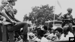 FILE - Members of the Youth Wing of the Indonesian Communist Party (Pemuda Rakjat) taken to prison in Jakarta, Oct. 30, 1965, after an abortive coup against President Sukarno's government earlier in the month.