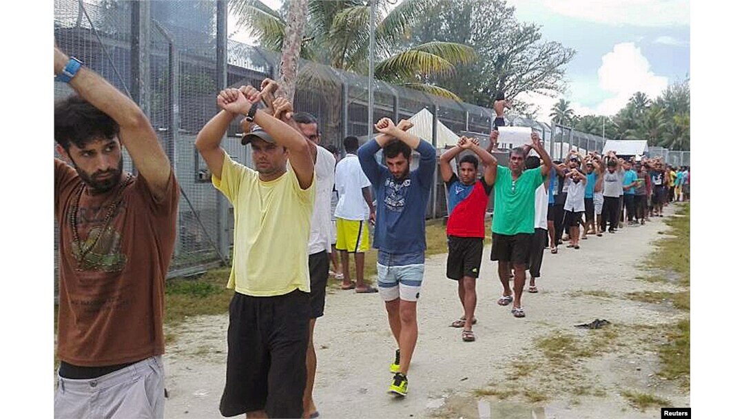 FILE - An undated image released Nov. 13, 2017, shows detainees staging a protest inside the compound at the Manus Island detention center in Papua New Guinea.