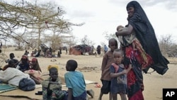 Refugees rest outside at the Dollo Ado refugee camp, Ethiopia. (file)