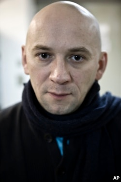 FILE - In this photo taken on Jan. 18, 2011, Russian documentary filmmaker Alexander Rastorguyev poses for a photo in Moscow.