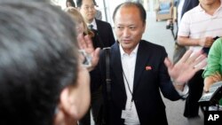 FILE - North Korean official Song Il Hyok refuses to answer questions from members of the media when he arrived to attend but not participate in a news conference following the Institute on Global Conflict and Cooperation conference on the campus of the U