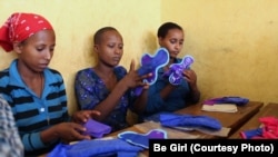 Ethiopian girls examine Be Girl’s affordable, reusable feminine hygiene products. Diana Sierra developed the project at the Halcyon House incubator in Washington, D.C.