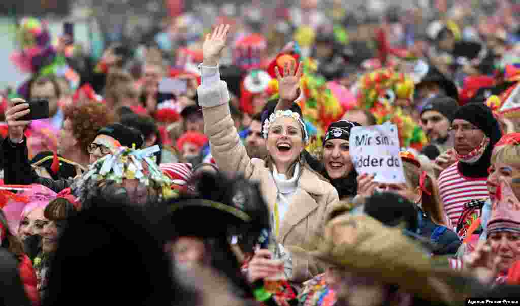 Revelers celebrate the start of the Carnival season in Cologne, western Germany.