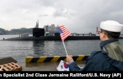The U.S. Navy's Ohio-class guided-missile submarine USS Michigan is greeted as it arrives in Busan, South Korea, for a scheduled port visit while conducting routine patrols throughout the western Pacific, April 24, 2017.