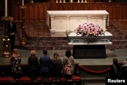Members of the public visit Former U.S. first lady Barbara Bush, the wife of the 41st president, George H.W. Bush, and mother of the 43rd, George W. Bush, as she lies in repose at St. Martin's Episcopal Church in Houston, Texas, April 20, 2018.