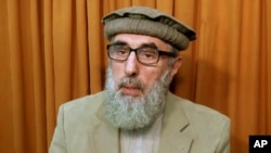 FILE - This image made from video released to the Associated Press during the week of Nov. 21, 2015 shows Afghan warlord Gulbuddin Hekmatyar, now in his late 60s, in an undisclosed location.