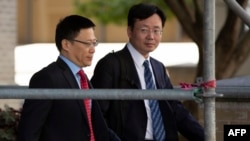 中國財政部副部長廖岷(左)率領中國代表團在華盛頓舉行美中貿易談判後離開。（2019年9月19日）
