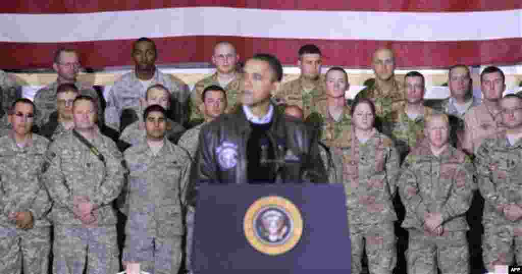 Members of the military listen to President Barack Obama at a rally during an unannounced visit at Bagram Air Field in Afghanistan, Friday, Dec. 3, 2010. (AP Photo/Pablo Martinez Monsivais)