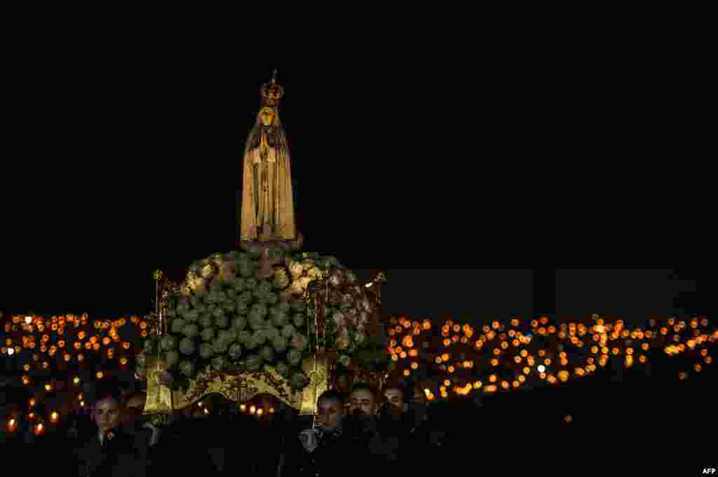 A statue of Our Lady Fatima is carried during the candle procession at the Fatima shrine in Fatima, central Portugal, May 12, 2019.