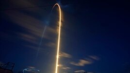 A SpaceX Falcon 9 rocket, with four private citizens onboard, lifts off in this time-exposure photo from Kennedy Space Center's Launch Pad 39-A, Wednesday, Sept. 15, 2021, in Cape Canaveral, Fla. (AP Photo/John Raoux)