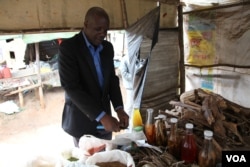 Dr. Denis, an herbalist in Blantyre, says a ban on traditional healers would make it hard for him to feed his family. (L. Masina/VOA)