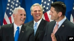Republican vice presidential candidate Mike Pence, left, House Majority Leader Kevin McCarthy of California, center, and House Speaker Paul Ryan of Wisconsin laugh during a news conference following a meeting on Capitol Hill in Washington, Sept. 13, 2016.