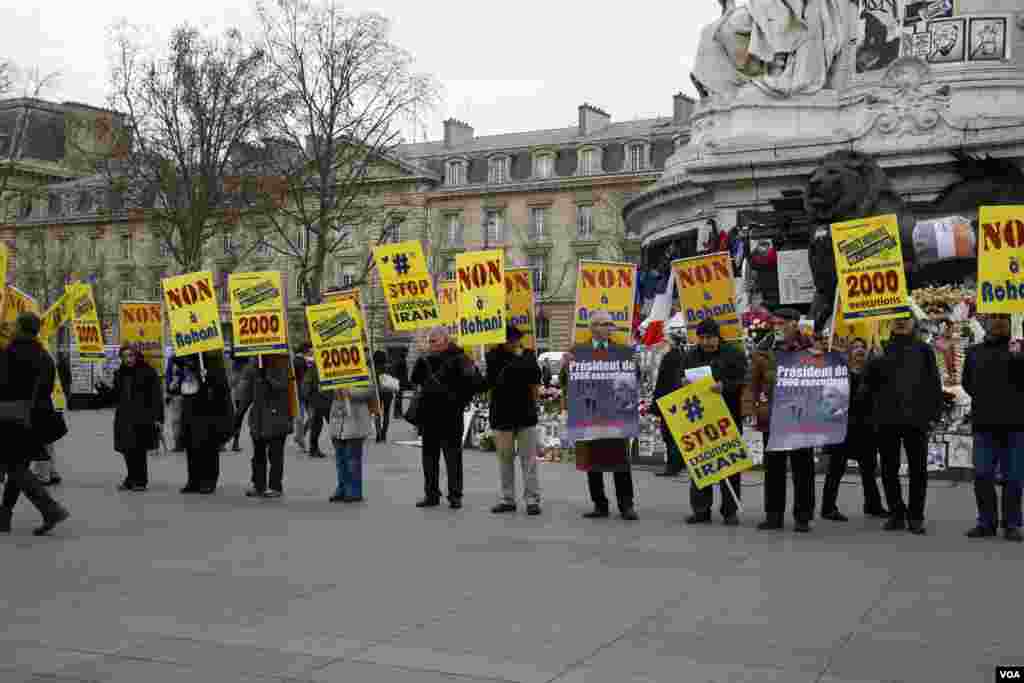 protest in paris against rouhani