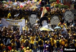 FILE - Pro-democracy group Bersih stage 1MDB protest, calling for Malaysian Prime Minister Najib Abdul Razak to resign, in Kuala Lumpur, Malaysia, Nov. 19, 2016.