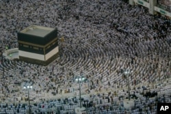 FILE - Muslim pilgrims pray at the Grand Mosque, ahead of the annual Hajj pilgrimage in the Muslim holy city of Mecca, Saudi Arabia, Muslim holy city of Mecca, Saudi Arabia, Aug. 18, 2018.