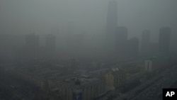Skyscrapers are obscure by heavy haze in Beijing Jan. 13, 2013.