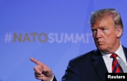 FILE - U.S. President Donald Trump gestures at his press conference after the NATO Summit in Brussels, Belgium, July 12, 2018.