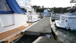 A dock was torn apart in a marina at Tutukaka, New Zealand, Jan. 16, 2022, when waves from a volcano eruption swept into the marina.