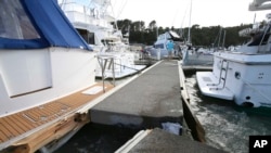 A dock was torn apart in a marina at Tutukaka, New Zealand, Jan. 16, 2022, when waves from a volcano eruption swept into the marina.