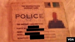 Nigerian police like Malo, whose ID badge is shown here, complain that the government is to blame for failures in the fight against Boko Haram. 