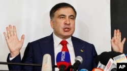 Mikheil Saakashvili, former Georgian president-turned-Ukrainian opposition leader, speaks to reporters in Warsaw, Poland, Feb. 13, 2018. 