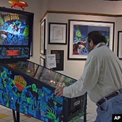 David Silverman, owner and curator of the National Pinball Museum plays one of the machines on exhibit