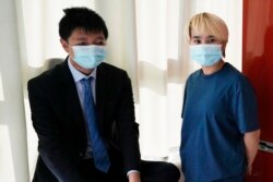 Wu Huan (kanan) bersama Wang di Ukraina, 30 Juni 2021. (AP)