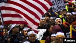 Protesters take part in a solidarity march from the Chinese Consulate to the United Nations (UN) Headquarters in support of Tibet in New York, December 10, 2012. The march also aims to brings to attention a string of self-immolations that have taken place