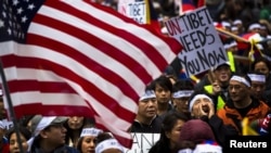 Protesters in the U.S. take part in a solidarity march from the Chinese Consulate to the United Nations (UN) Headquarters in support of Tibet in New York, December 10, 2012. 