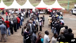 Kenyans line up to donate blood for those injured in Saturday's terrorist attack on a shopping mall, at Uhuru Park in Nairobi, Kenya, Monday, Sept. 23, 2013.