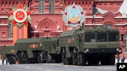 FILE - Iskander missile launchers are part of a parade in Red Square in Moscow, Russia, May 9, 2015. Russia airlifted its state-of-the art Iskander missiles to Kaliningrad, a Russian region on the Baltic Sea.
