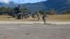 Proses evakuasi prajurit TNI Yonif Raider 400/BR yang ditembak Kelompok Separatis Bersenjata (KSB), Jumat, 22 Januari 2021. (Courtesy: Kogabwilhan III).