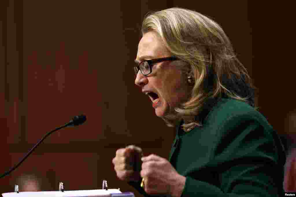 U.S. Secretary of State Hillary Clinton pounds her fists as she responds to intense questioning on the September attacks on U.S. diplomatic sites in Benghazi, Libya, during a Senate Foreign Relations Committee hearing on Capitol Hill in Washington, D.C.