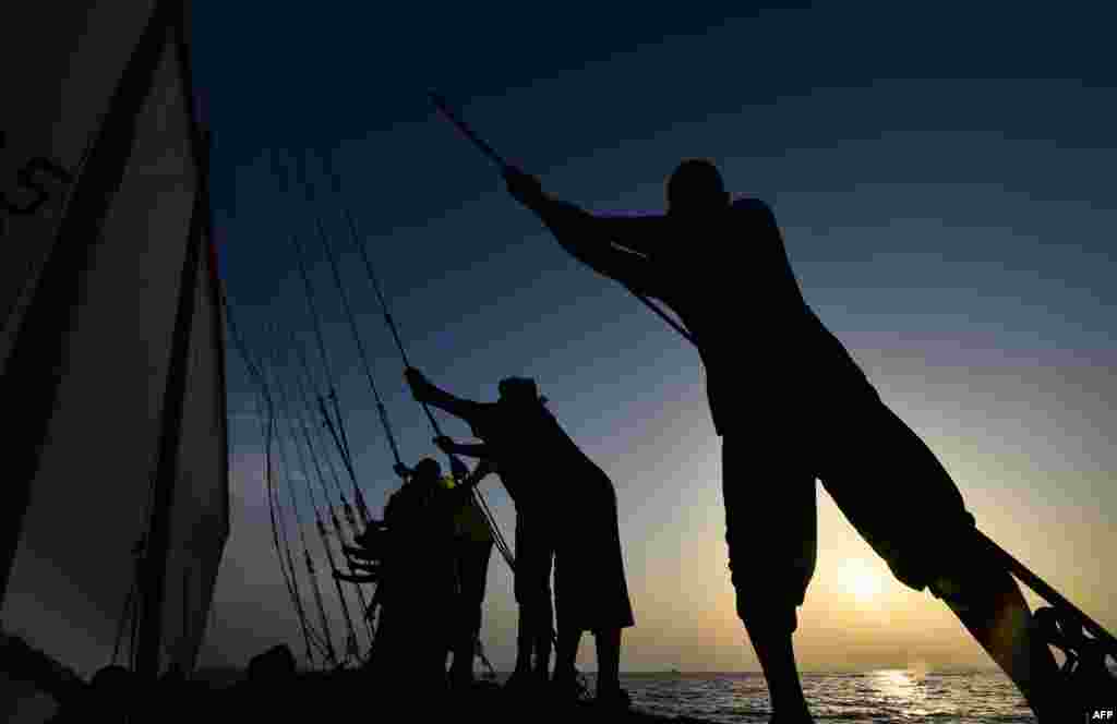 Sailors participate in a training session on the eve of al-Gaffal, a traditional long-distance dhow sailing race near the island of Sir Bu Nair. Over 100 dhow boats will take part in the race from Sir Bu Nayer Island to Dubai.