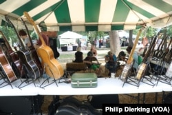 A stand in Elkins, West Virginia, selling guitars and mandolins, two common instruments in old-time music.