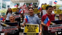 FILE - Protesters rally outside of the Chinese Consulate in Manila, Philippines, June 10, 2016. Relations between China and the Philippines have been strained following an international court's ruling in July in Manila’s favor, rejecting Beijing’s claims to large parts of the South China Sea.