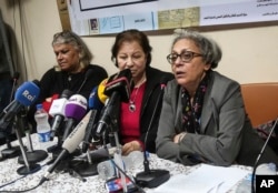 FILE - Aida Seif el-Dawla, Suzan Fayyad, center, and Magda Adly, right, co-founder of El Nadeem Center for Rehabilitation of Victims of Violence, hold a press conference in Cairo, Feb. 21, 2016. On Feb. 9, 2017, Egypt's police closed the El-Nadeem Center, a rights organization that documents alleged abuse of detainees by Egyptian police and security agencies.