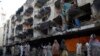 کراچی: ہلاک ہونے والوں کی تدفین، فضا سوگوار