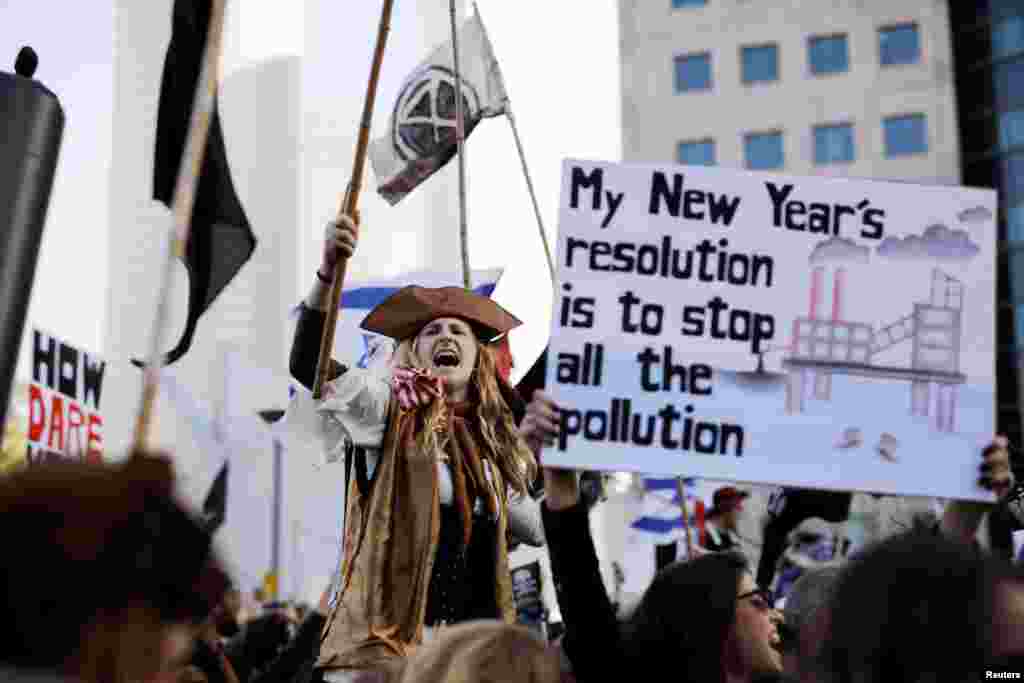 A protester holds a placard during a demonstration against Israel&#39;s offshore Leviathan natural gas field due to environmental concerns in Tel Aviv, Israel.