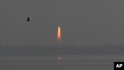 Indian Space Research Organisation’s Geosynchronous Satellite Launch Vehicle (GSLV Mark-III) rocket lifts off carrying CARE (Crew Module Atmospheeric Re-entry Experiment) from the east coast island of Sriharikota, India, Thursday Dec. 18, 2014. 