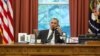 U.S. President Barack Obama speaks with Iranian President Hassan in this official White House photo released Sept. 27, 2013.